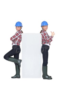 Mirror image of female builder clipart