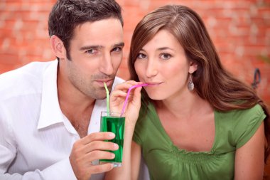 Couple drinking cocktails clipart