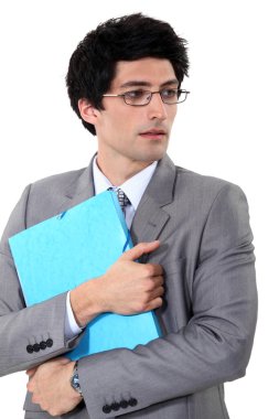 Businessman holding a folder clipart