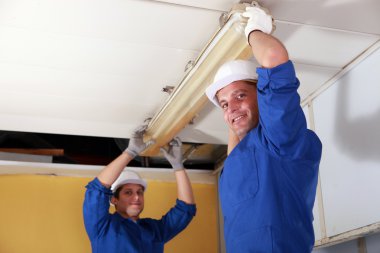 Electricians installing neon clipart