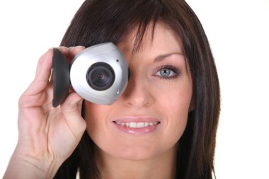 Studio shot of a woman with a webcam clipart