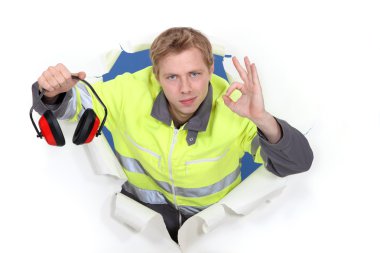 Tradesman promoting the use of earmuffs clipart