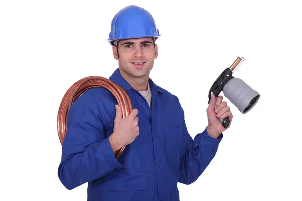 Plumber with a blowtorch — Stock Photo, Image