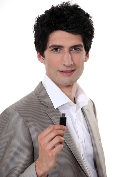 Affärsman som håller USB-minne — Stockfoto