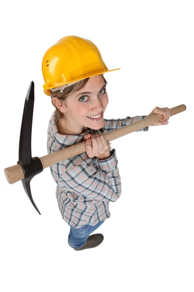 High-angle shot of a tradeswoman carrying a pickaxe — Stock Photo, Image