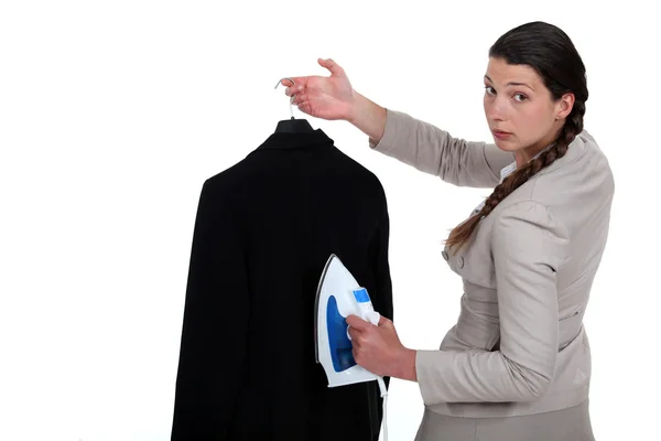 stock image Woman ironing a suit