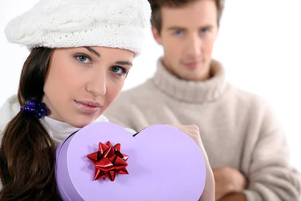 Couple with a heart shaped box — Stock Photo, Image