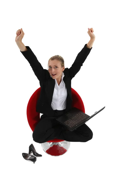 Woman victorious at her laptop — Stock Photo, Image
