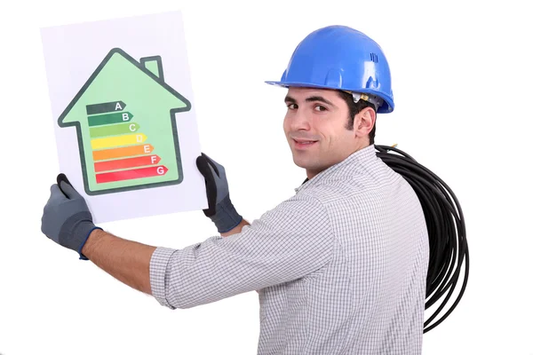 Electrician with an energy rating card — Stock Photo, Image
