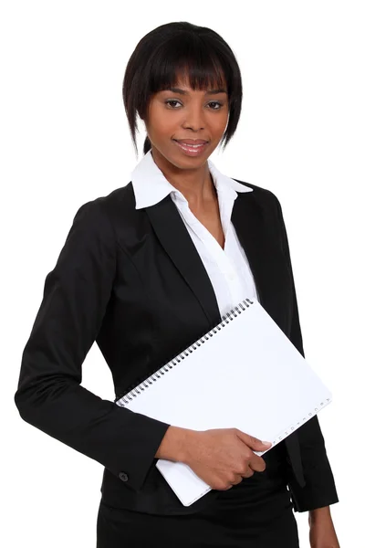 African woman with notebook in hand — Stock Photo, Image
