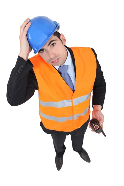 An overwhelmed engineer trying to be a traffic guard — Stock Photo, Image