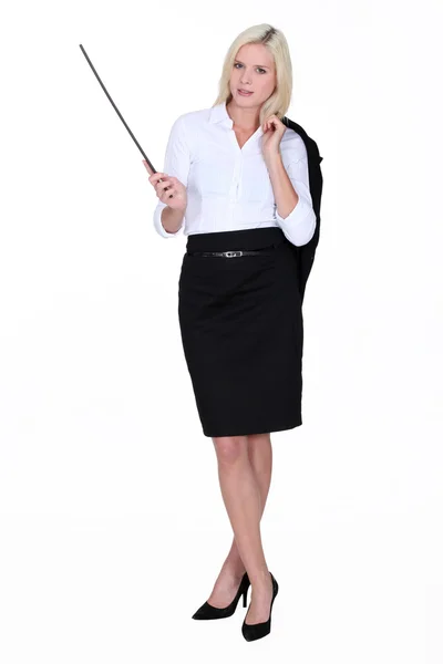 Businesswoman holding a conductor's baton — Stock Photo, Image