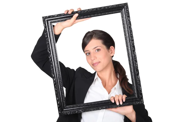 Woman behind black frame — Stock Photo, Image