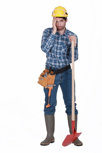 Tired man with spade — Stock Photo, Image