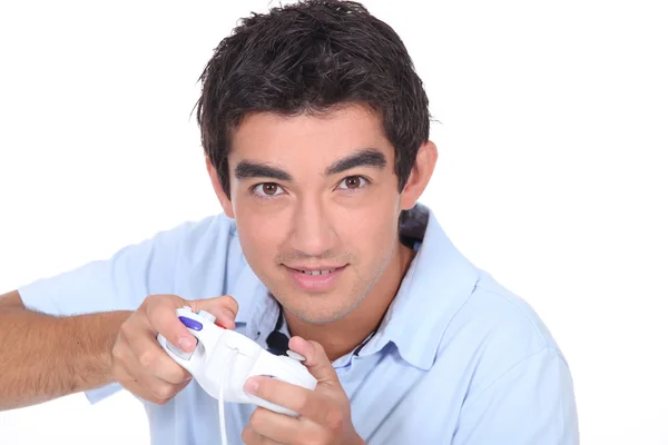 Young man is playing video games — Stock Photo, Image
