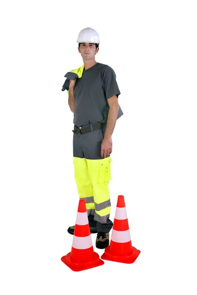 Laborer with traffic cones — Stock Photo, Image