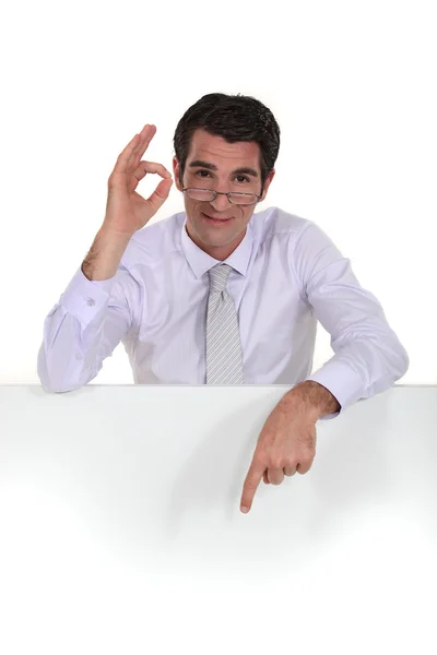 Businessman giving his sign of approval — Stock Photo, Image