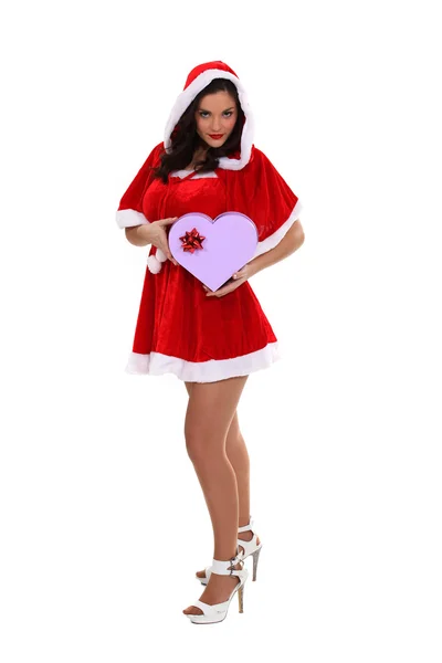 Hot lady Christmas giving a heart shaped gift — Stock Photo, Image