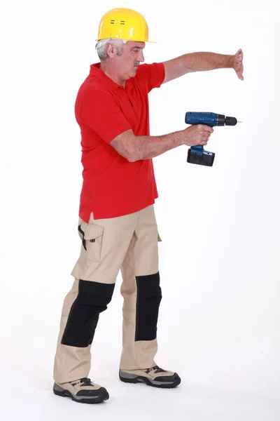 Tradesman using a power tool — Stock Photo, Image