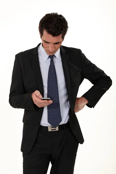 Businessman receiving a text message — Stock Photo, Image