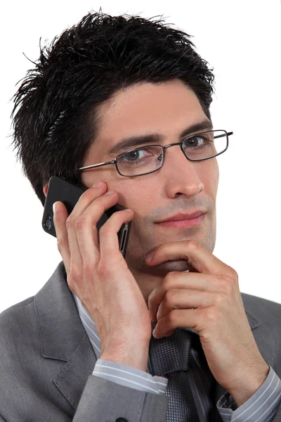 Young businessman talking on his cell — Stock Photo, Image