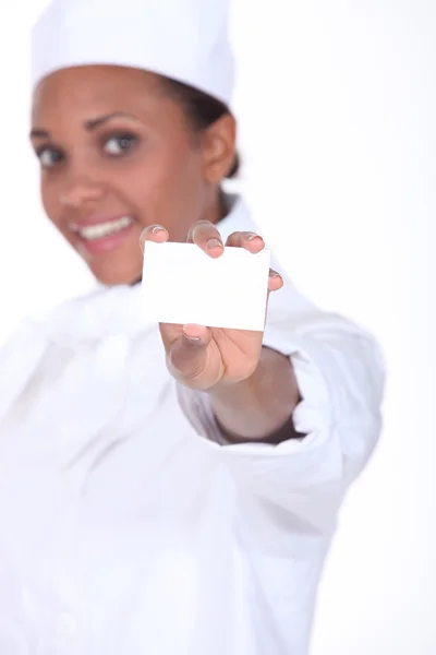 Woman caterer showing business card — Stock Photo, Image