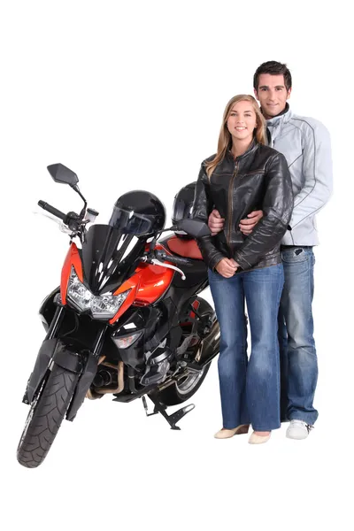 Пара с мотоциклом — стоковое фото