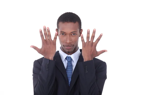 Mann im Anzug mit erhobenen Händen im Gesicht — Stockfoto