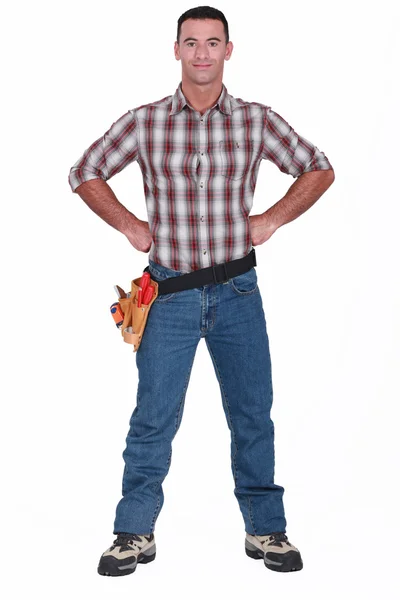 Artisan posing with hands on hips — Stock Photo, Image