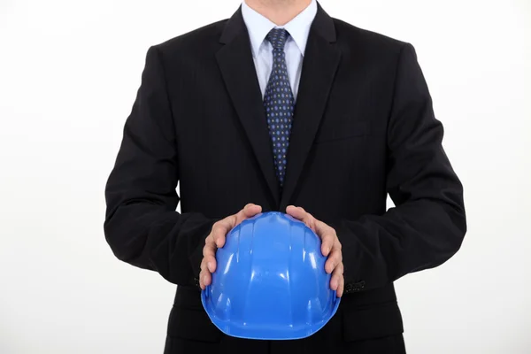 Architect holding his hard hat — Stock Photo, Image