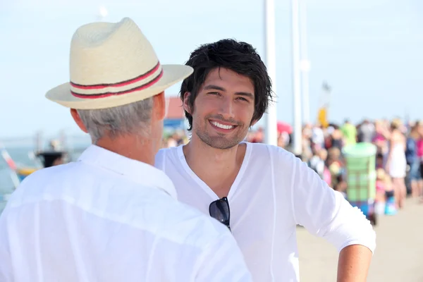 Grandfather and grandson with in the background — Stock Photo, Image