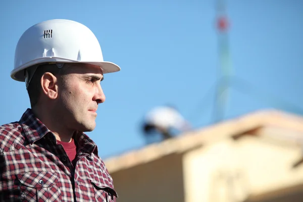 Construction foreman on a building site — Stock Photo, Image