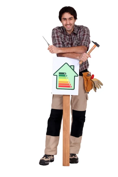 Worker with an energy efficiency sign — Stock Photo, Image