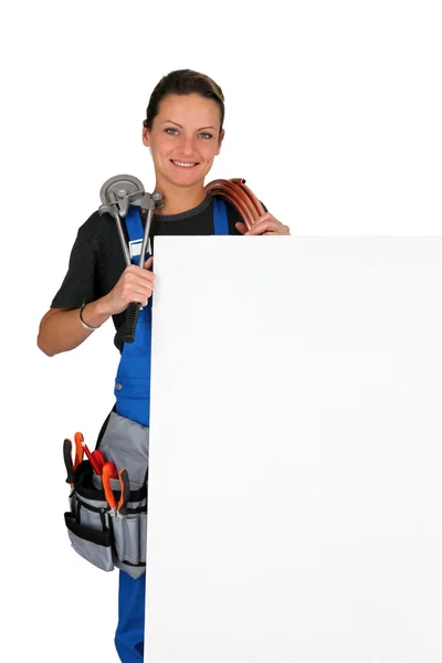 Female plumber and equipment — Stock Photo, Image