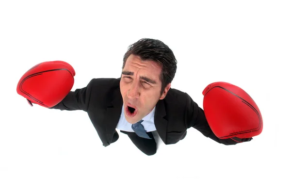 Businessman wearing boxing gloves and celebrating victory — Stock Photo, Image