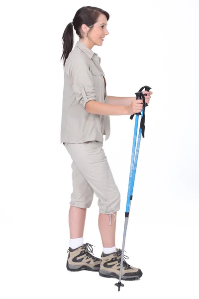 Foto de estudio de una caminante femenina con postes —  Fotos de Stock