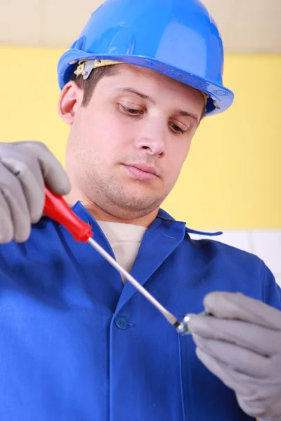 Electrician with screwdriver — Stock Photo, Image