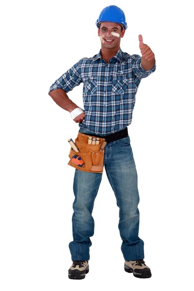 Injured builder giving the thumbs-up — Stock Photo, Image