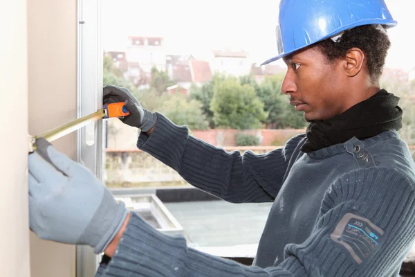 Wall measuring worker — Stock Image Wall measuring worker Stock Picture