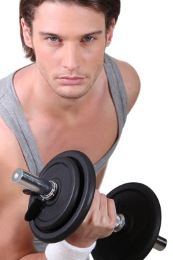 A determined young man working out clipart
