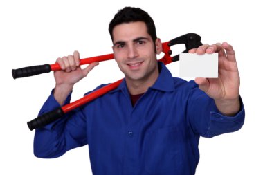 Worker with giant spanner holding business card clipart