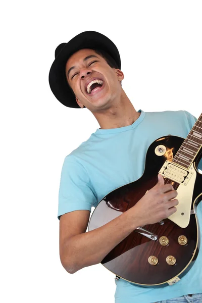 An enthusiastic guitar player — Stockfoto