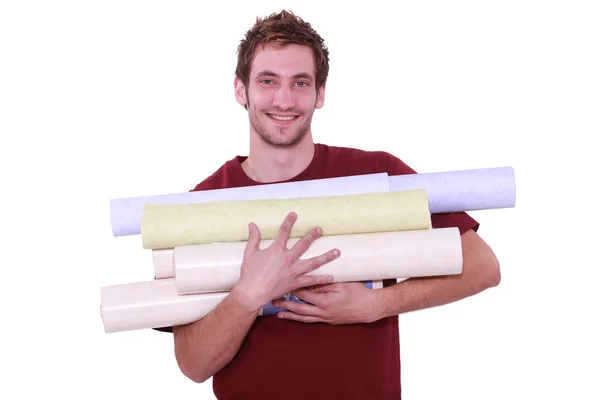 Homem com rolos de papel de parede — Fotografia de Stock