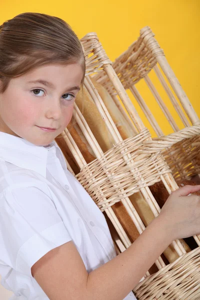 Girl with basket of bread — Stock Photo, Image
