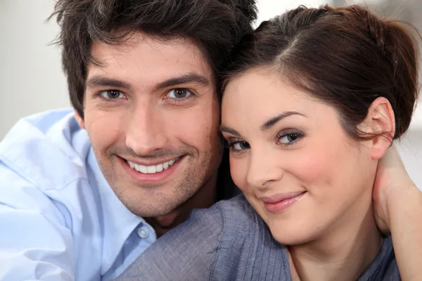 Couple sat hugging at home — Stock Photo, Image