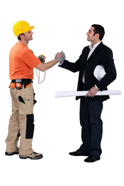 Engineering forming a pact with a tradesman — Stock Photo, Image