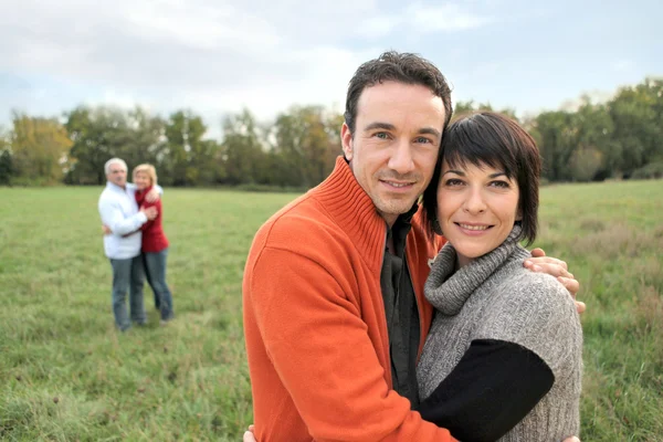 Couple hugging in the countryside Stock Image