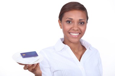 Smiling waitress with the bill and a credit card clipart