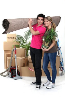 Young couple moving house clipart