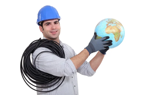 Eletricista capacete segurando globo — Fotografia de Stock